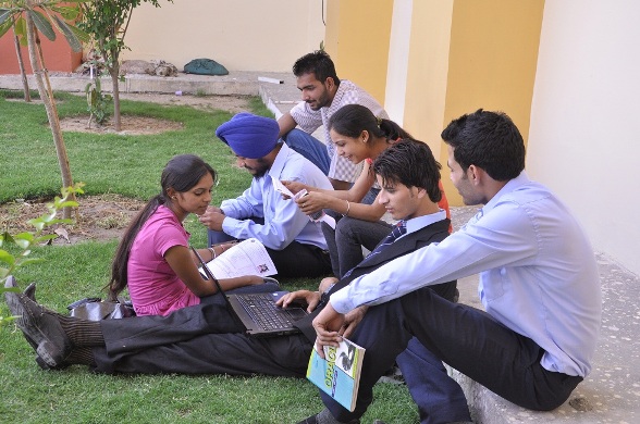 a group of people sitting on the ground